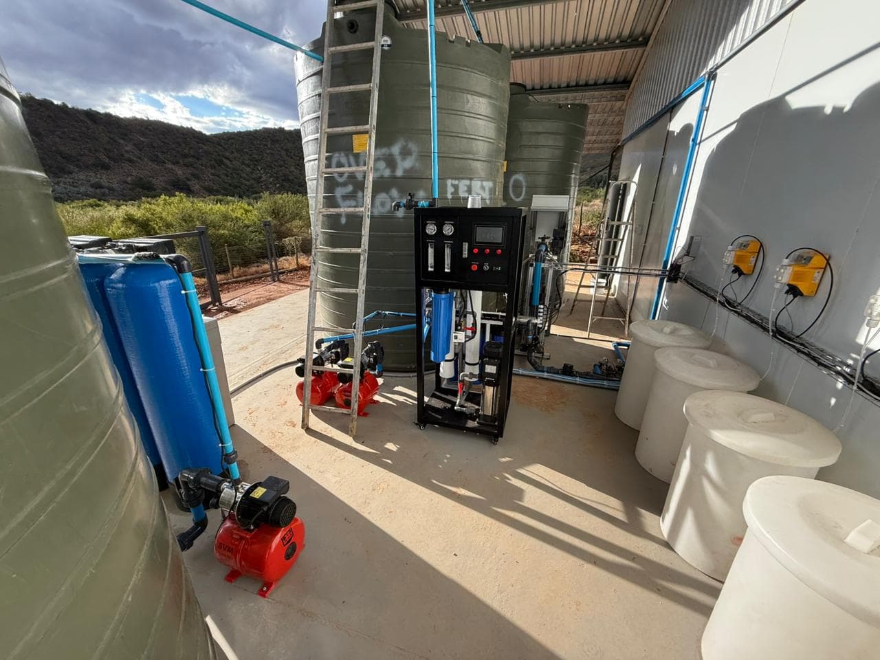 State-of-the-art water treatment and fertigation system with tanks, pumps and control panels